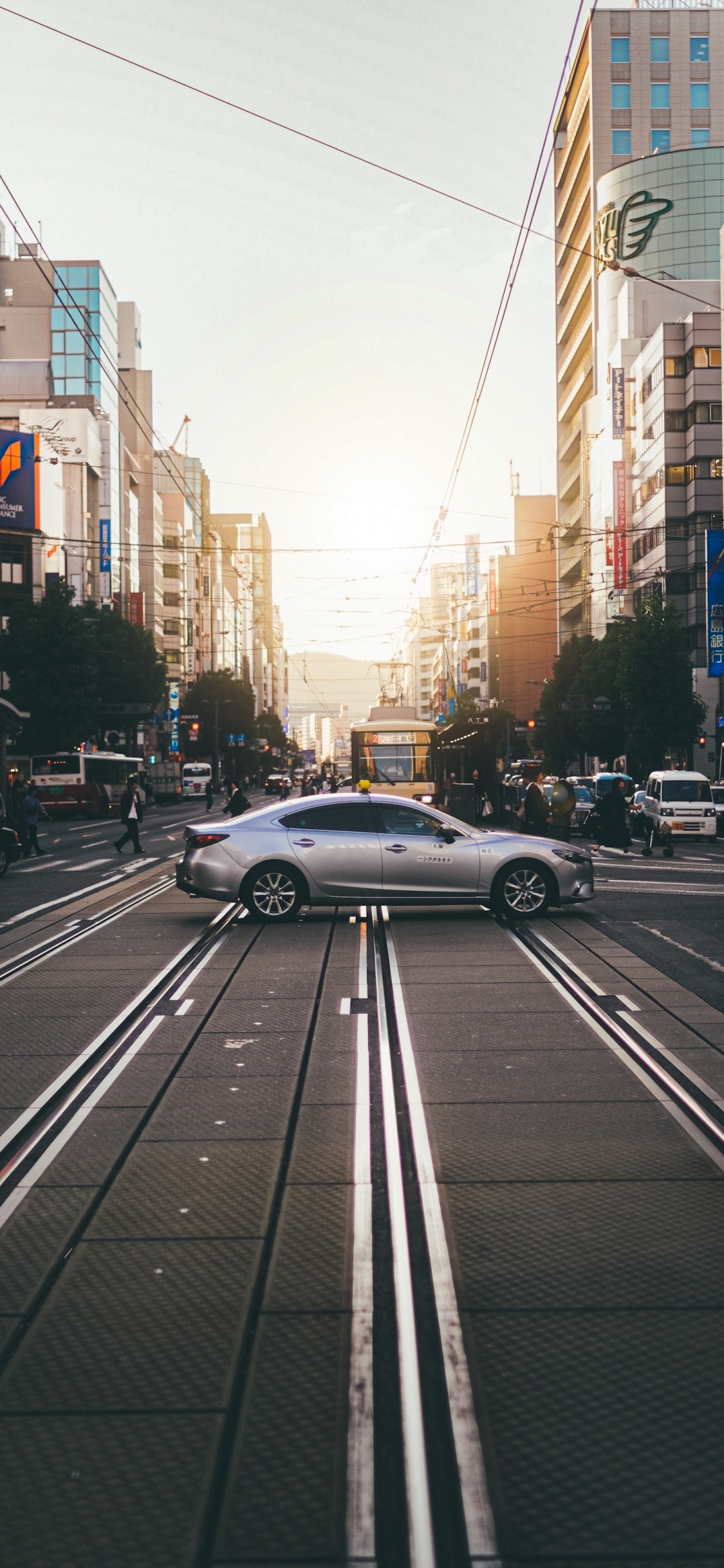 Cars, Wheel, Tire, Daytime, Building. Wallpaper in 1125x2436 Resolution