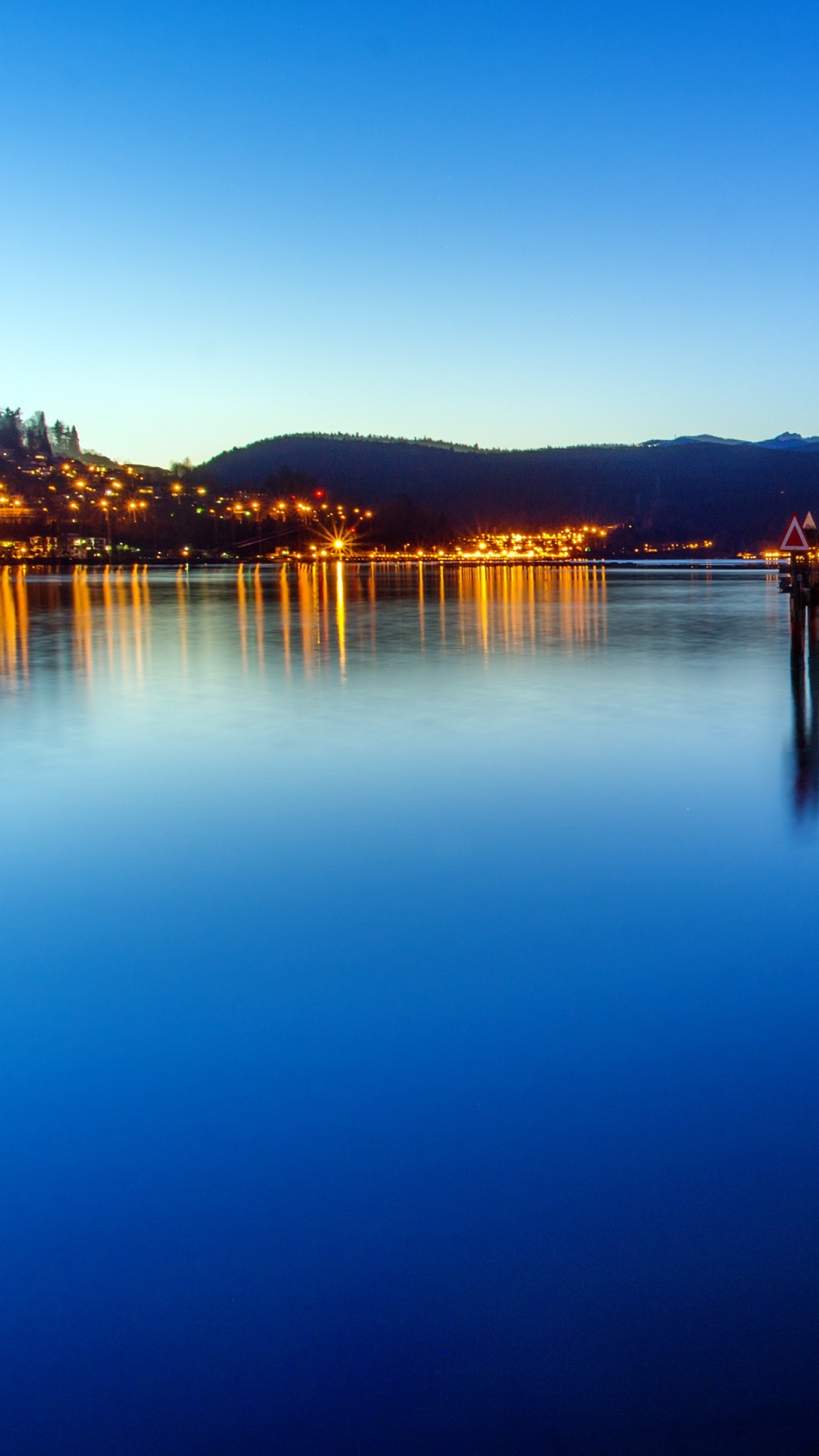 Body of Water Near City During Night Time. Wallpaper in 1080x1920 Resolution