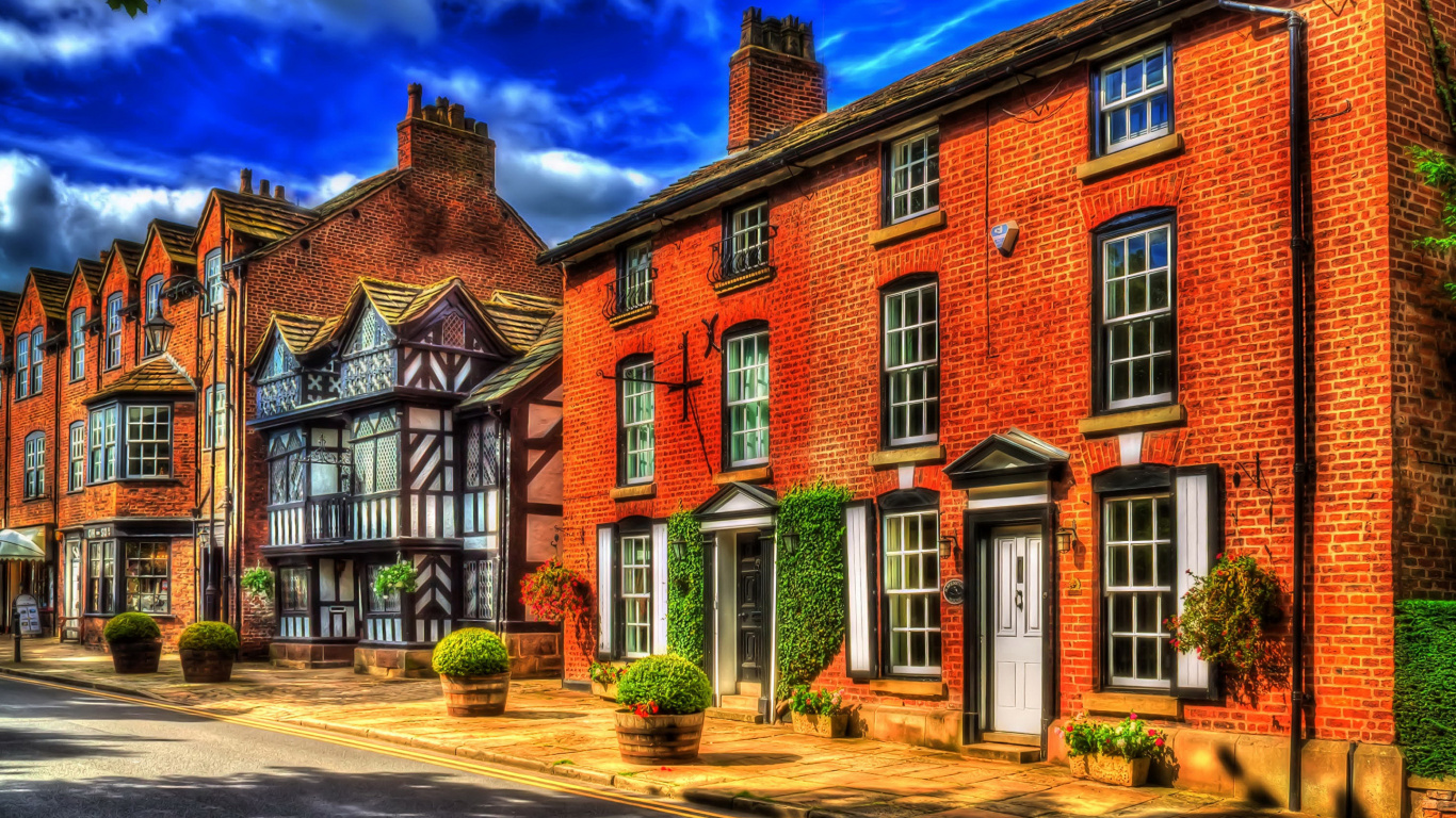Brown Brick Building Under Blue Sky. Wallpaper in 1366x768 Resolution
