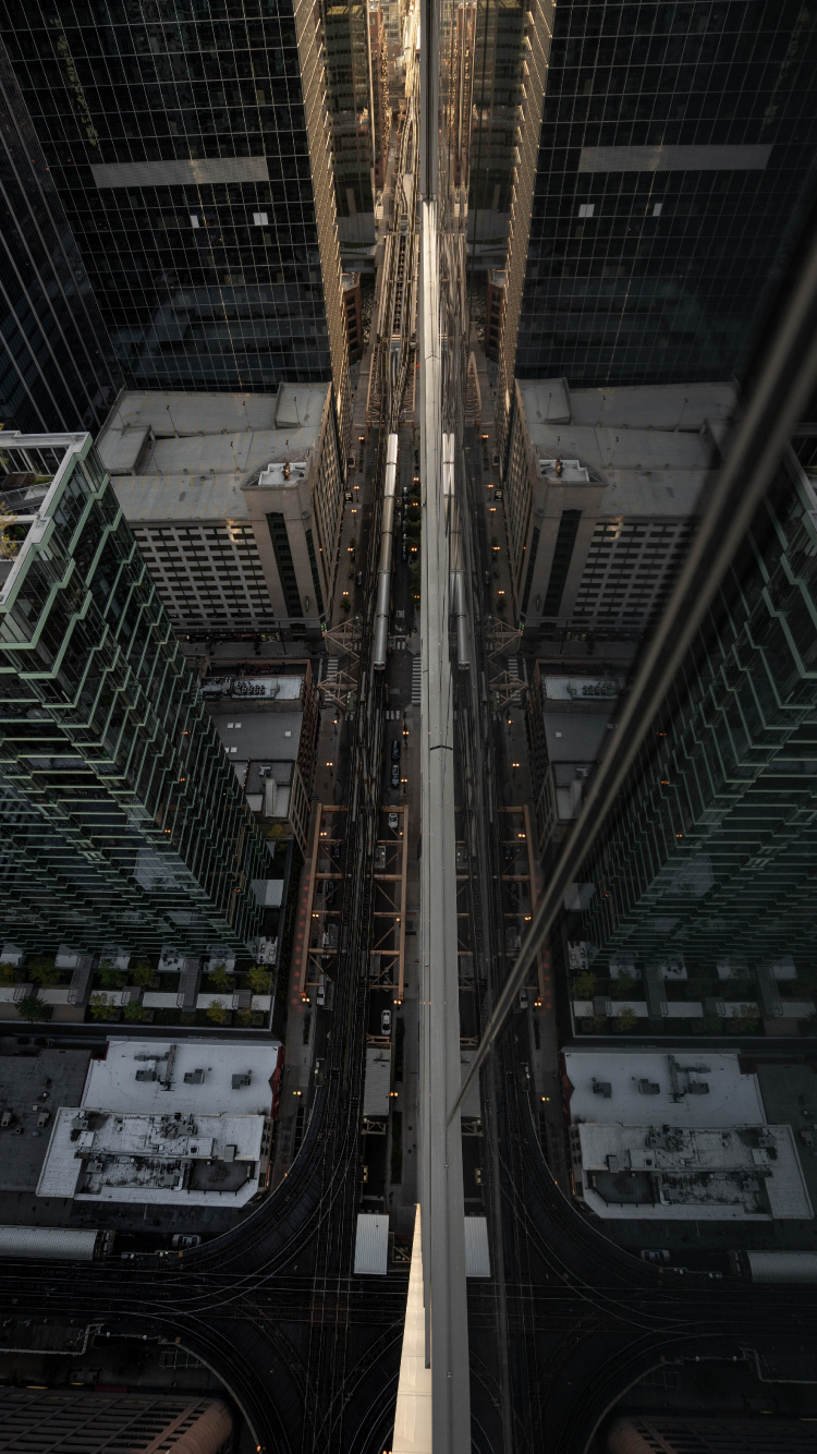 Vue Grand Angle Des Bâtiments de la Ville Pendant la Journée. Wallpaper in 750x1334 Resolution