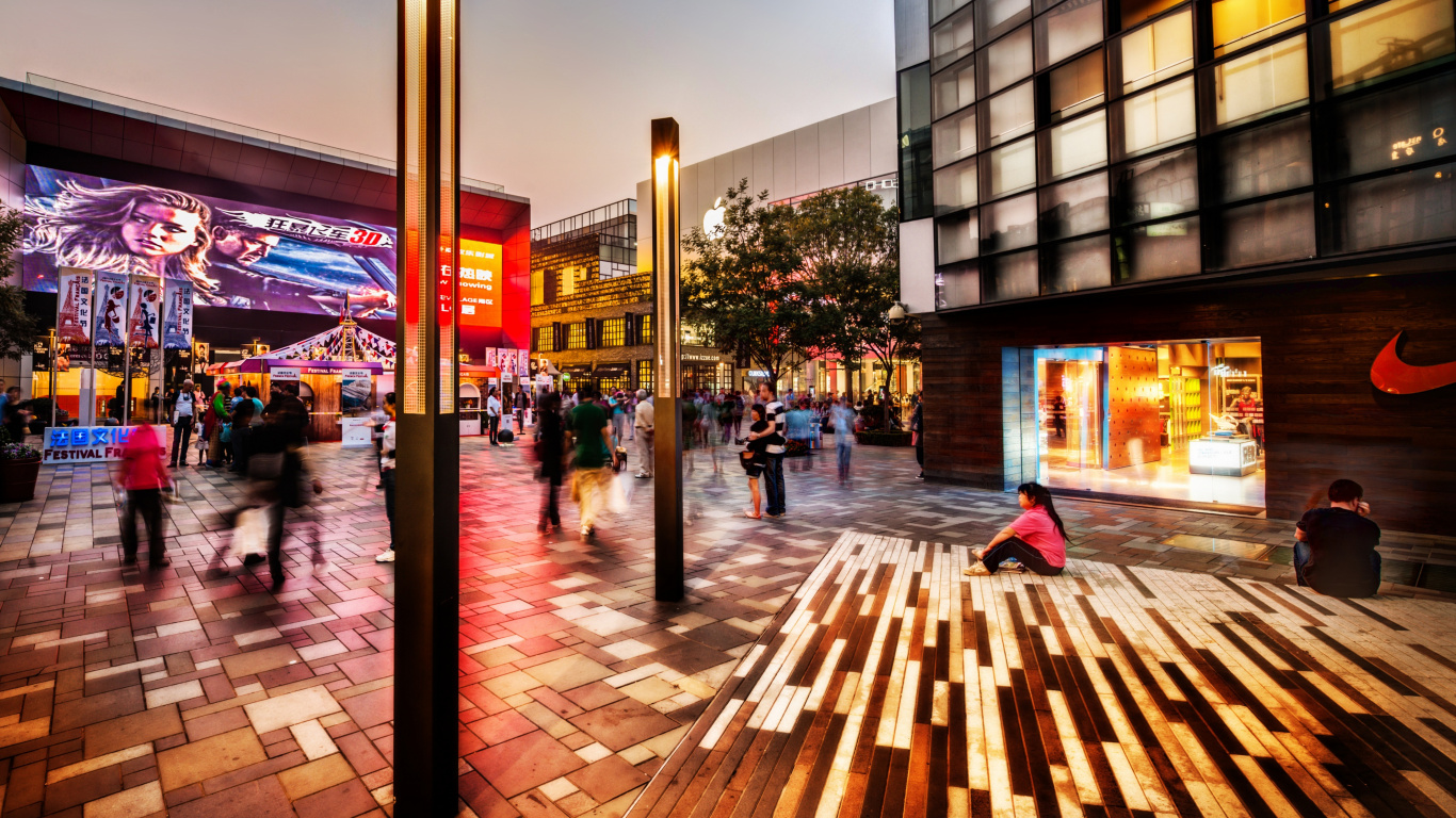 People Walking on Sidewalk Near Building During Night Time. Wallpaper in 1366x768 Resolution