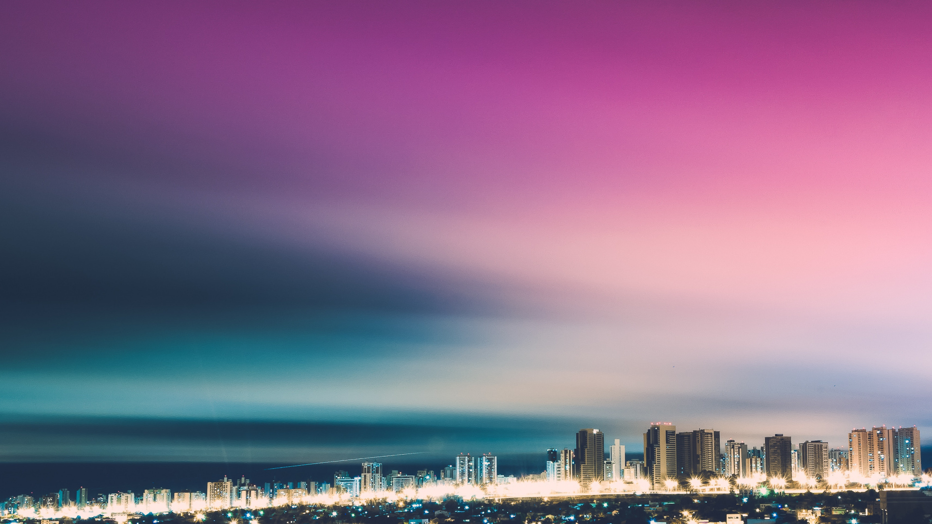 City Skyline Under Purple Sky. Wallpaper in 1920x1080 Resolution