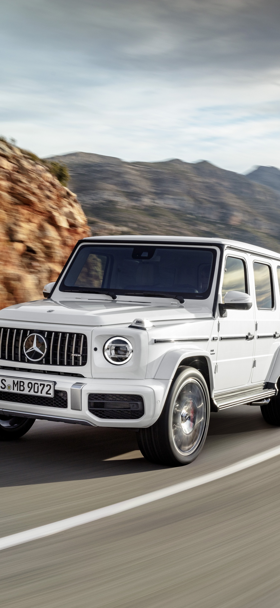 White Suv on Road During Daytime. Wallpaper in 1125x2436 Resolution