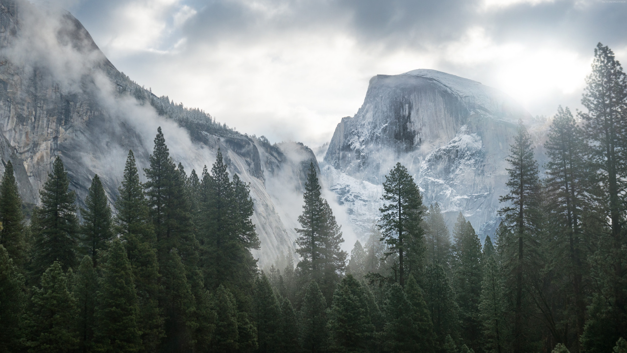 Green Pine Trees Near Snow Covered Mountain Under White Clouds During Daytime. Wallpaper in 1280x720 Resolution