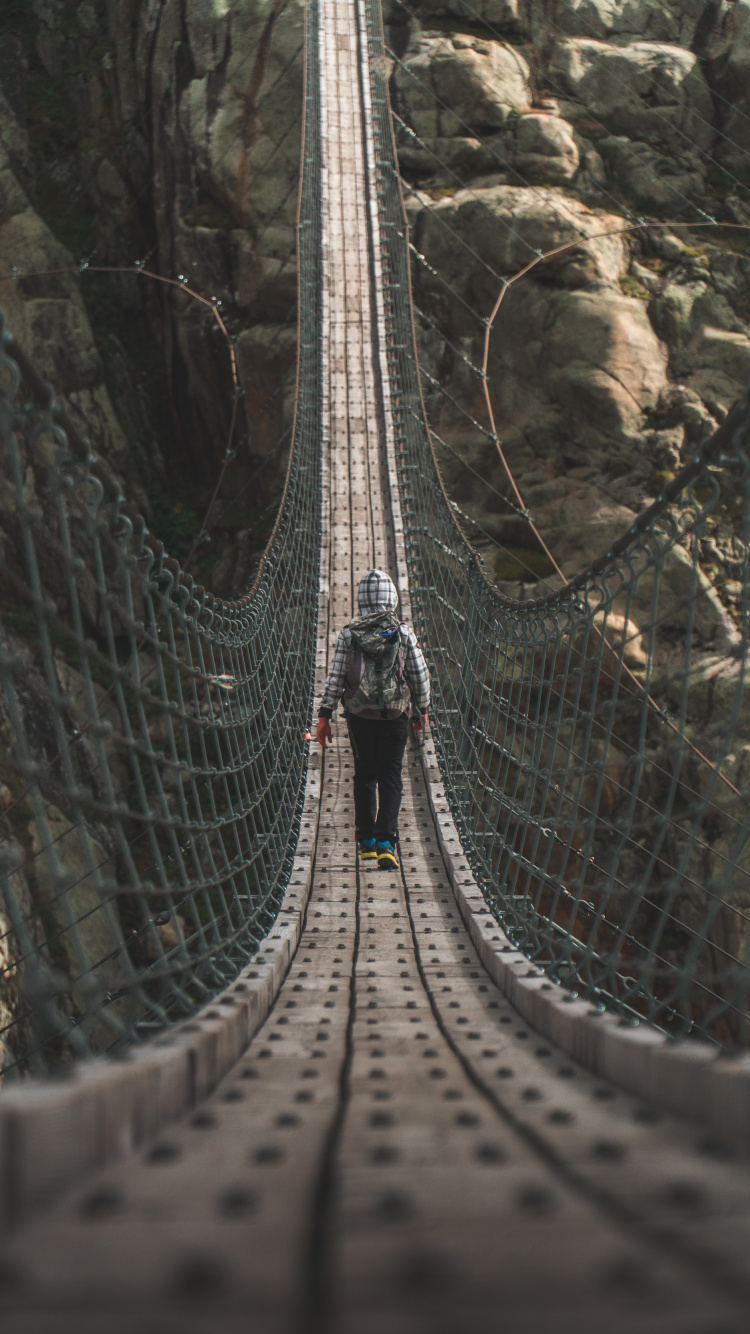 People Walking on Hanging Bridge During Daytime. Wallpaper in 750x1334 Resolution
