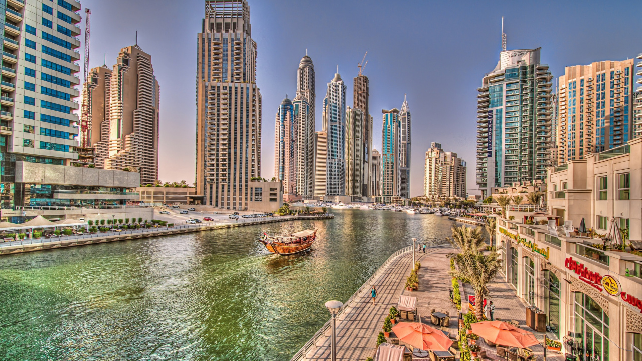 Red and White Boat on Water Near City Buildings During Daytime. Wallpaper in 1280x720 Resolution