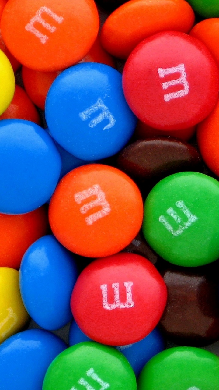Blue Orange Green and Yellow m ms Chocolate Candies. Wallpaper in 720x1280 Resolution
