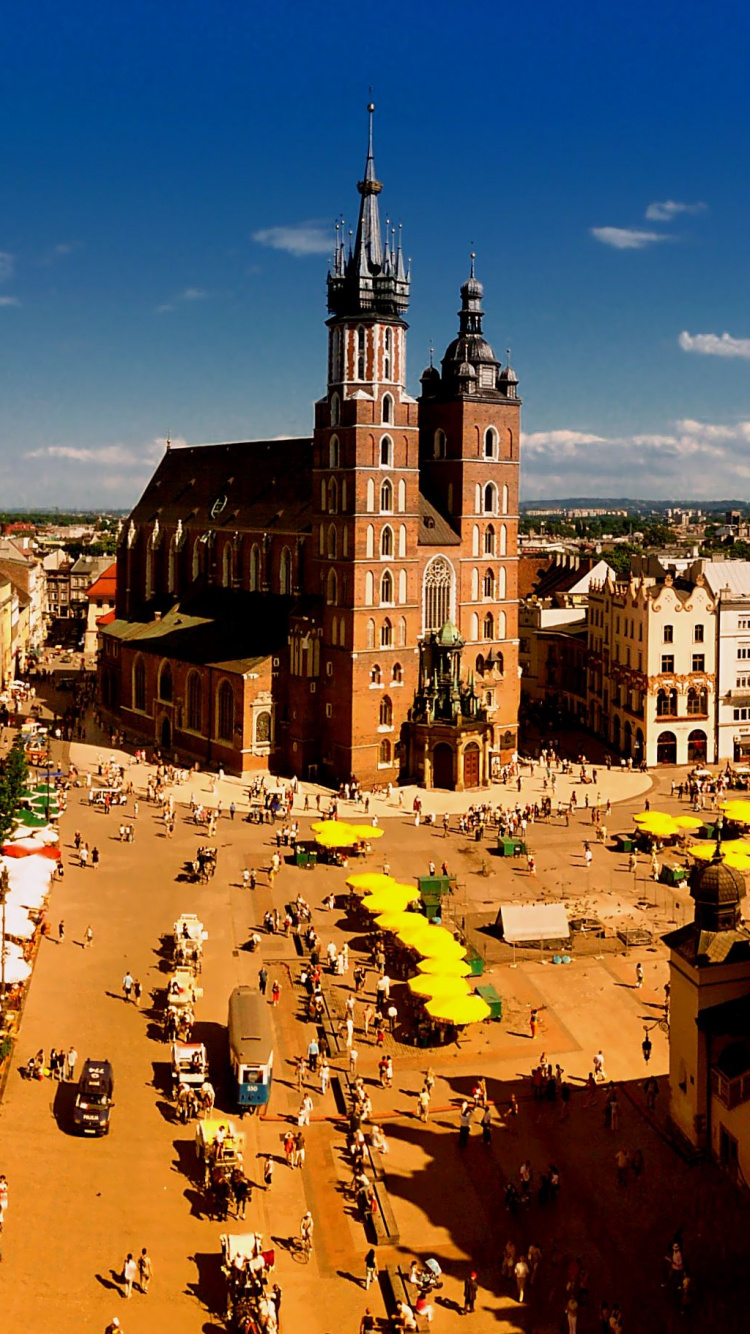 Personnes Marchant Dans la Rue Près D'un Bâtiment en Béton Brun Pendant la Journée. Wallpaper in 750x1334 Resolution