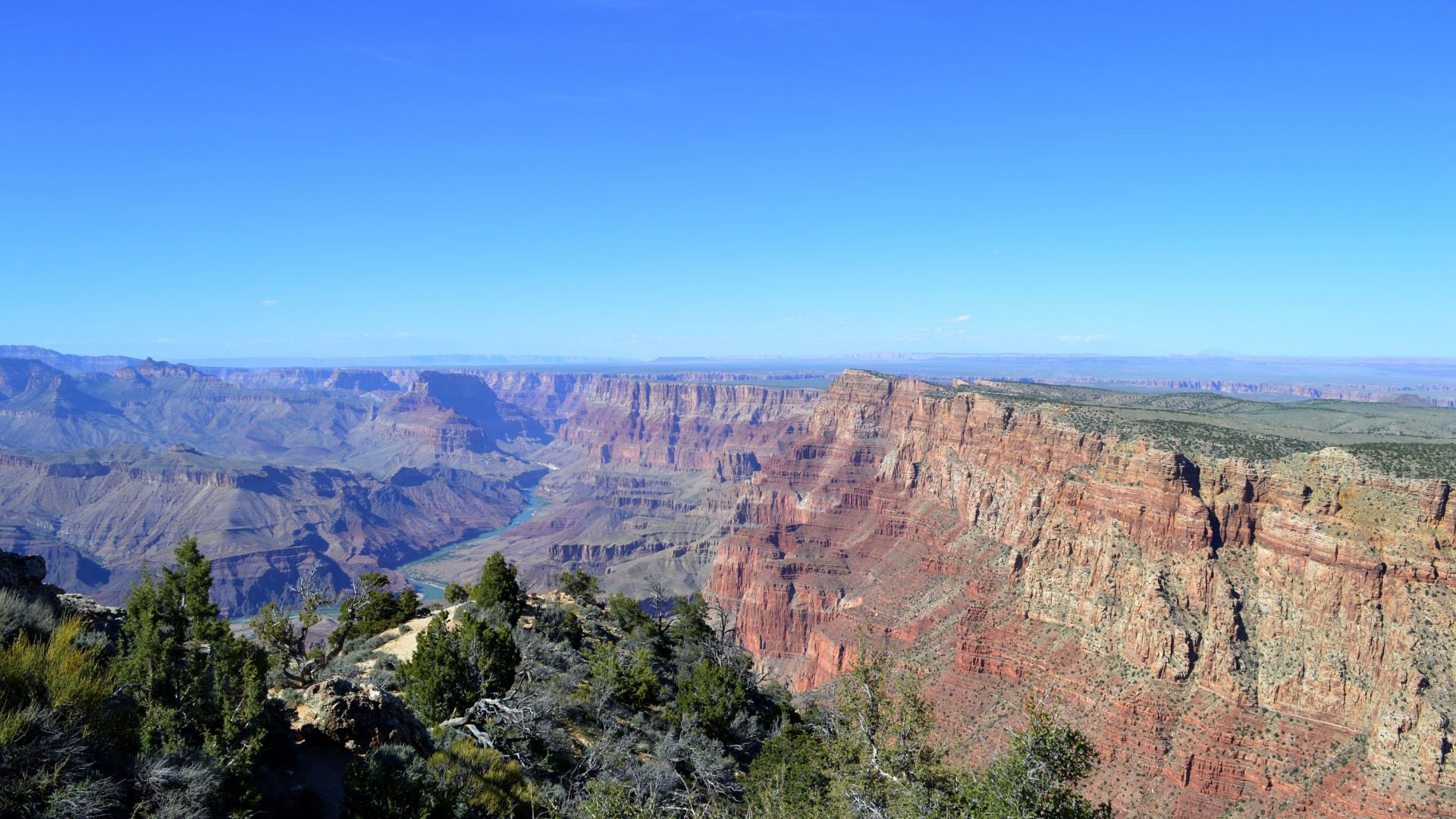 Brauner Felsiger Berg Unter Blauem Himmel Tagsüber. Wallpaper in 1920x1080 Resolution