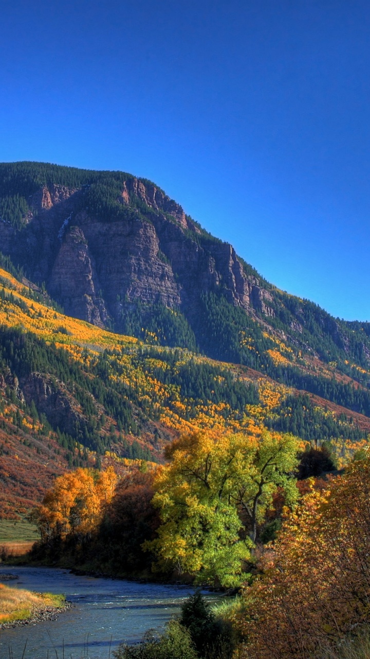 Green and Brown Mountains Under Blue Sky During Daytime. Wallpaper in 720x1280 Resolution