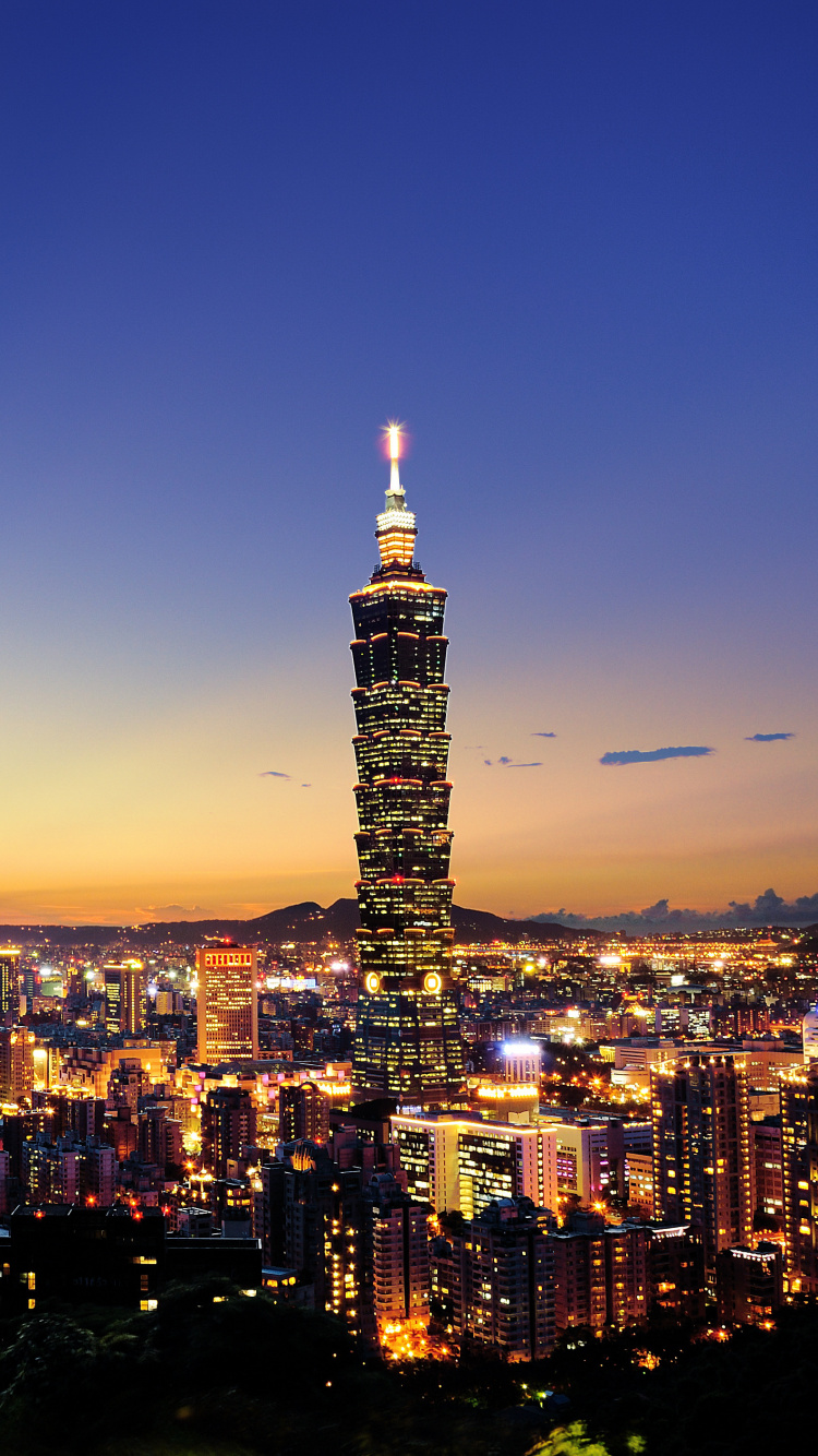 City With High Rise Buildings During Night Time. Wallpaper in 750x1334 Resolution