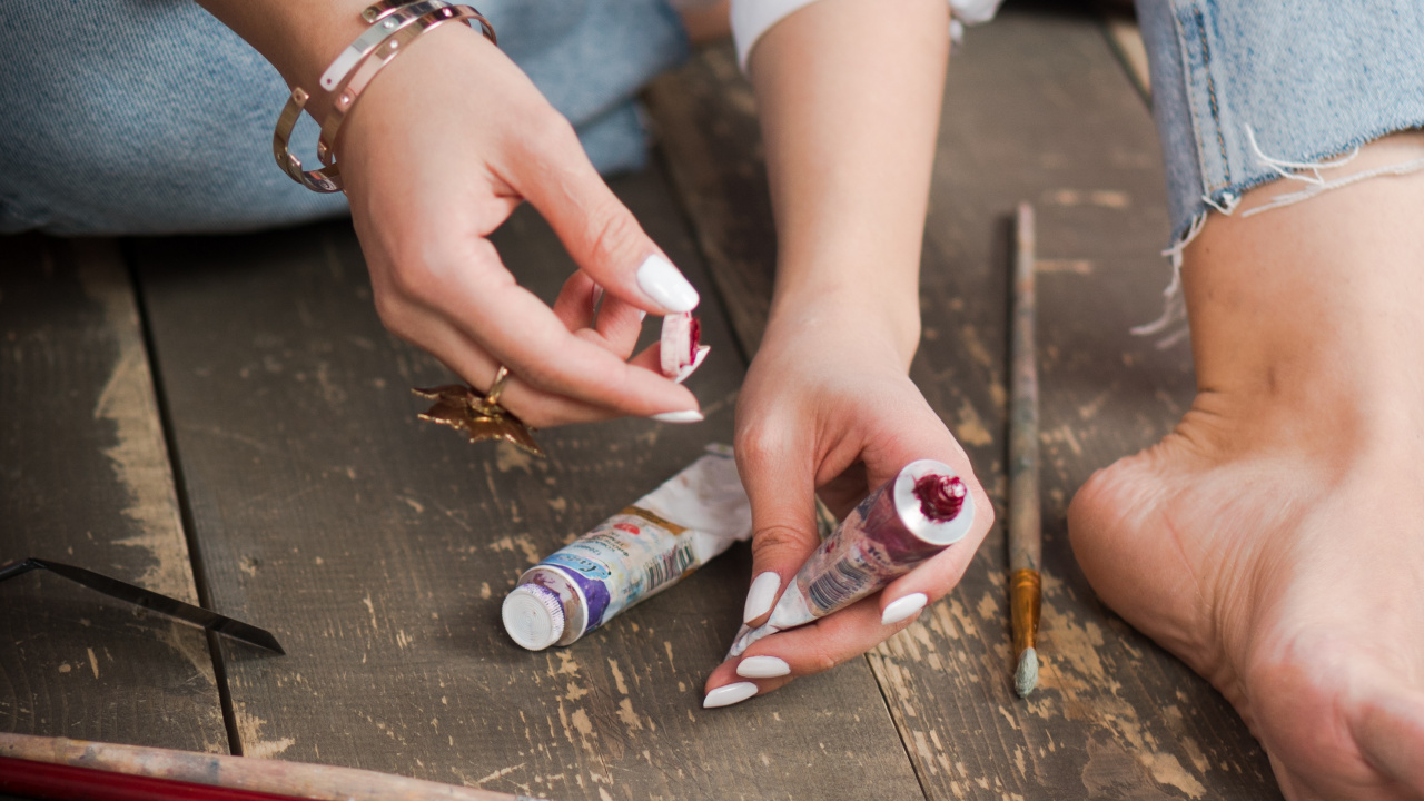 Person in Blue Denim Jeans Holding Red and Silver Click Pen. Wallpaper in 1280x720 Resolution