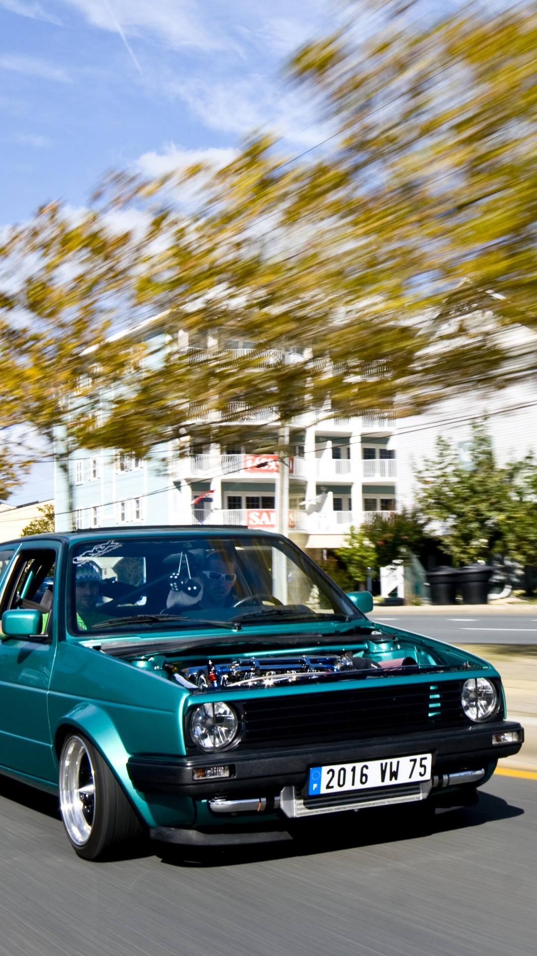 Blue Volkswagen Golf on Road During Daytime. Wallpaper in 1080x1920 Resolution