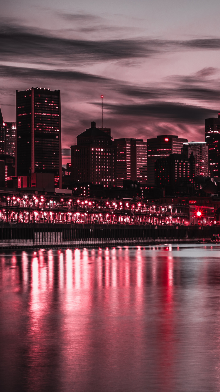 City Skyline Across Body of Water During Night Time. Wallpaper in 750x1334 Resolution