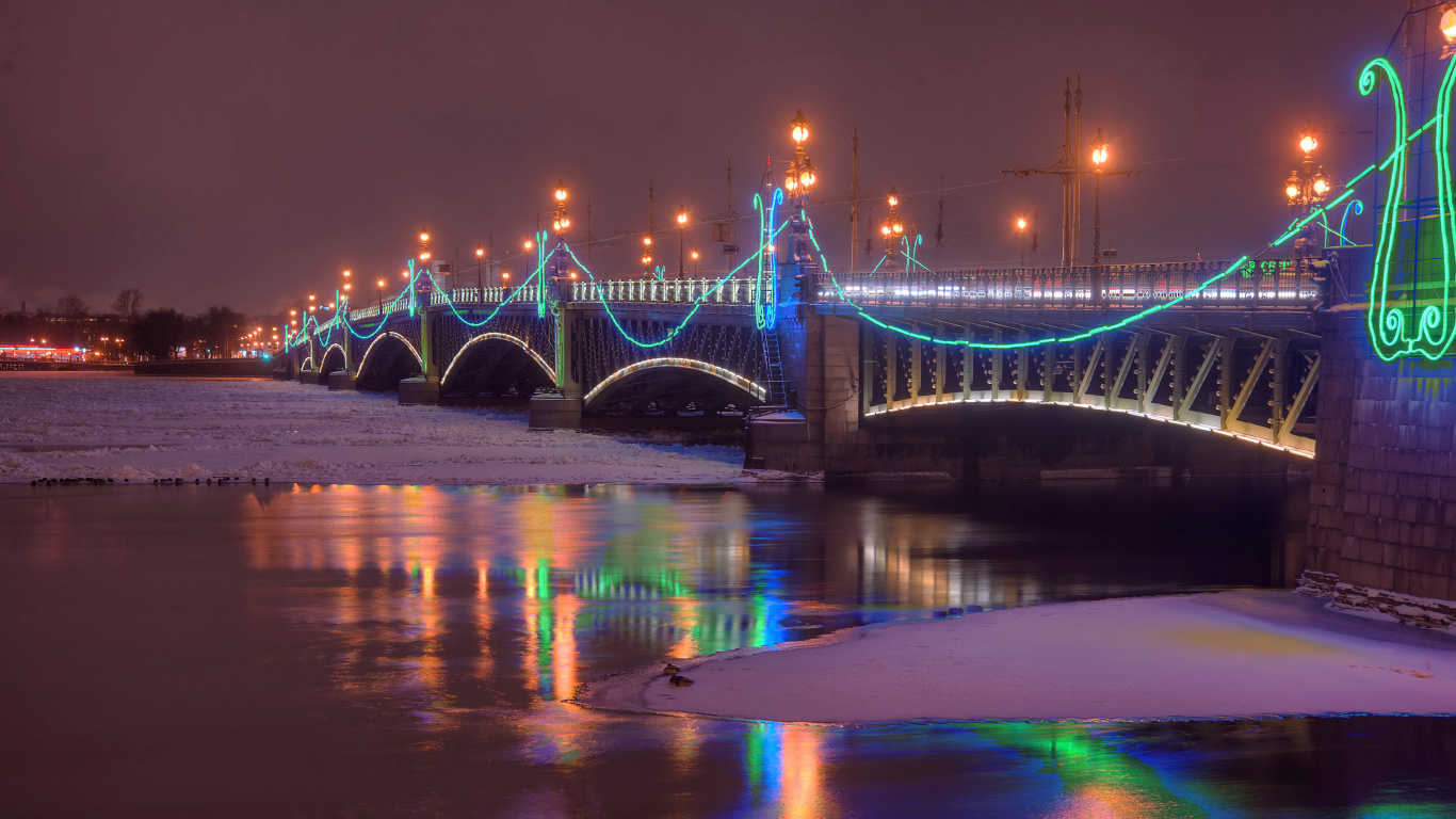 Blue Bridge Over Water During Night Time. Wallpaper in 1366x768 Resolution