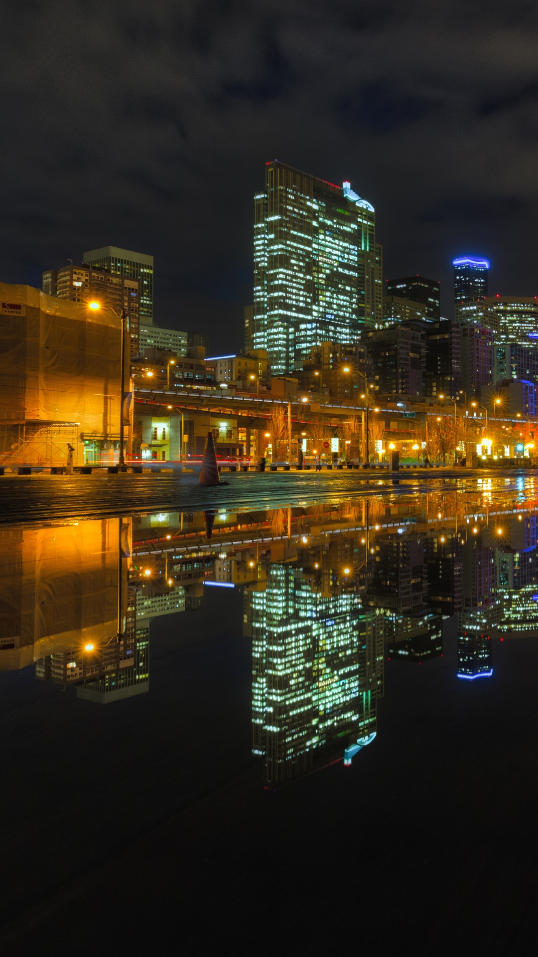 City Skyline Across Body of Water During Night Time. Wallpaper in 1080x1920 Resolution