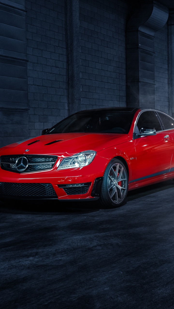 Rotes Bmw m 3 Coupe Auf Grauem Betonpflaster Geparkt. Wallpaper in 720x1280 Resolution