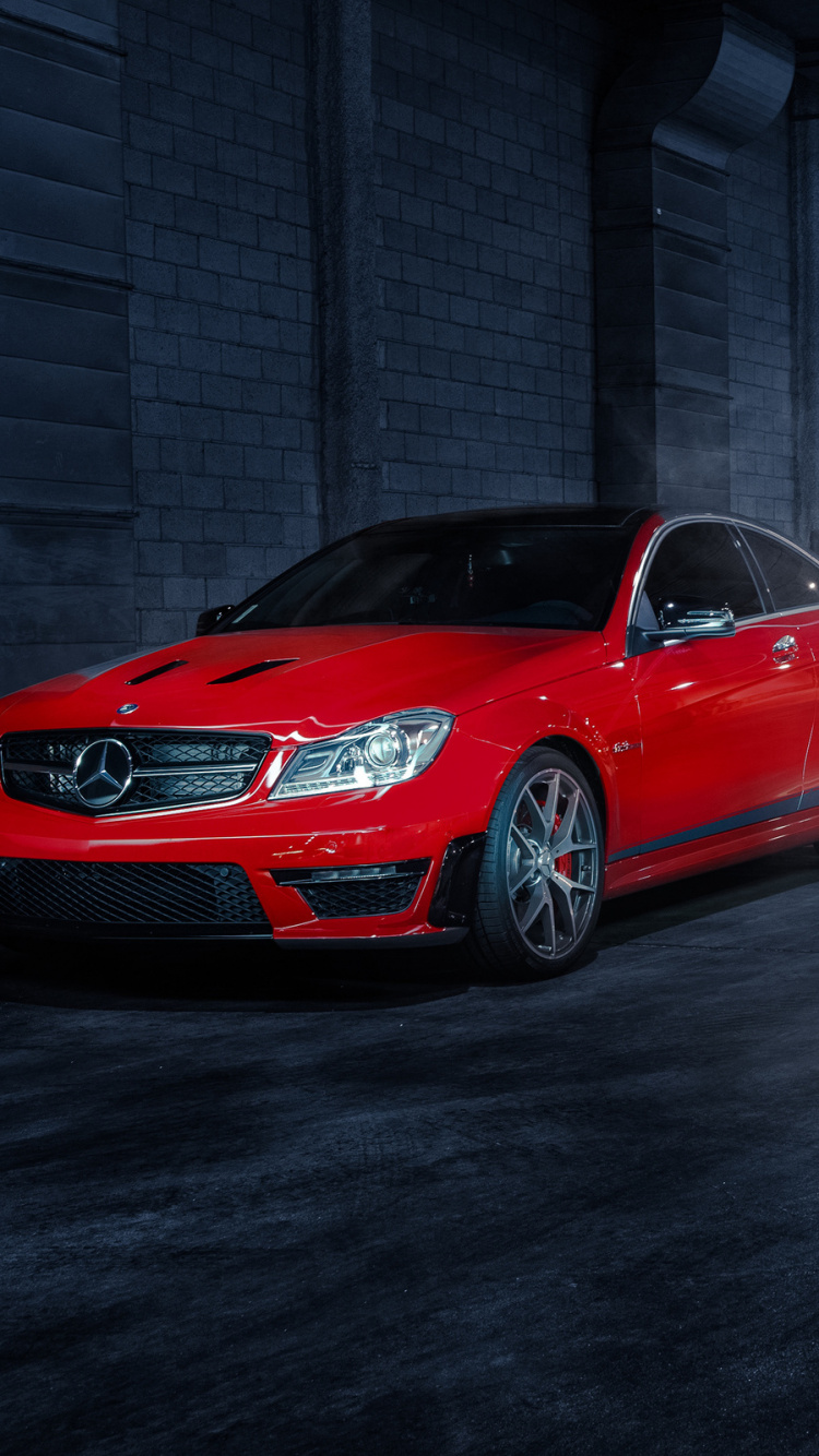 Rotes Bmw m 3 Coupe Auf Grauem Betonpflaster Geparkt. Wallpaper in 750x1334 Resolution