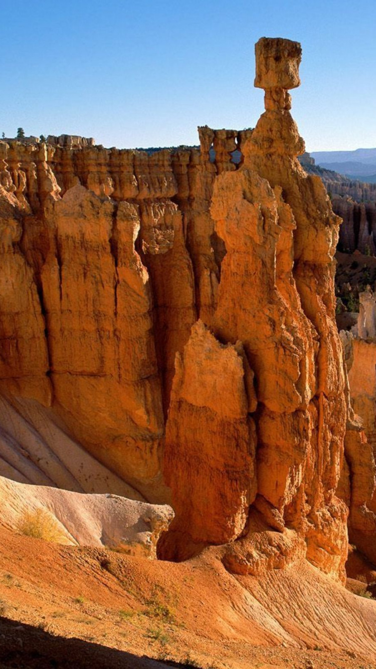 Brown Rock Formation Under Blue Sky During Daytime. Wallpaper in 750x1334 Resolution