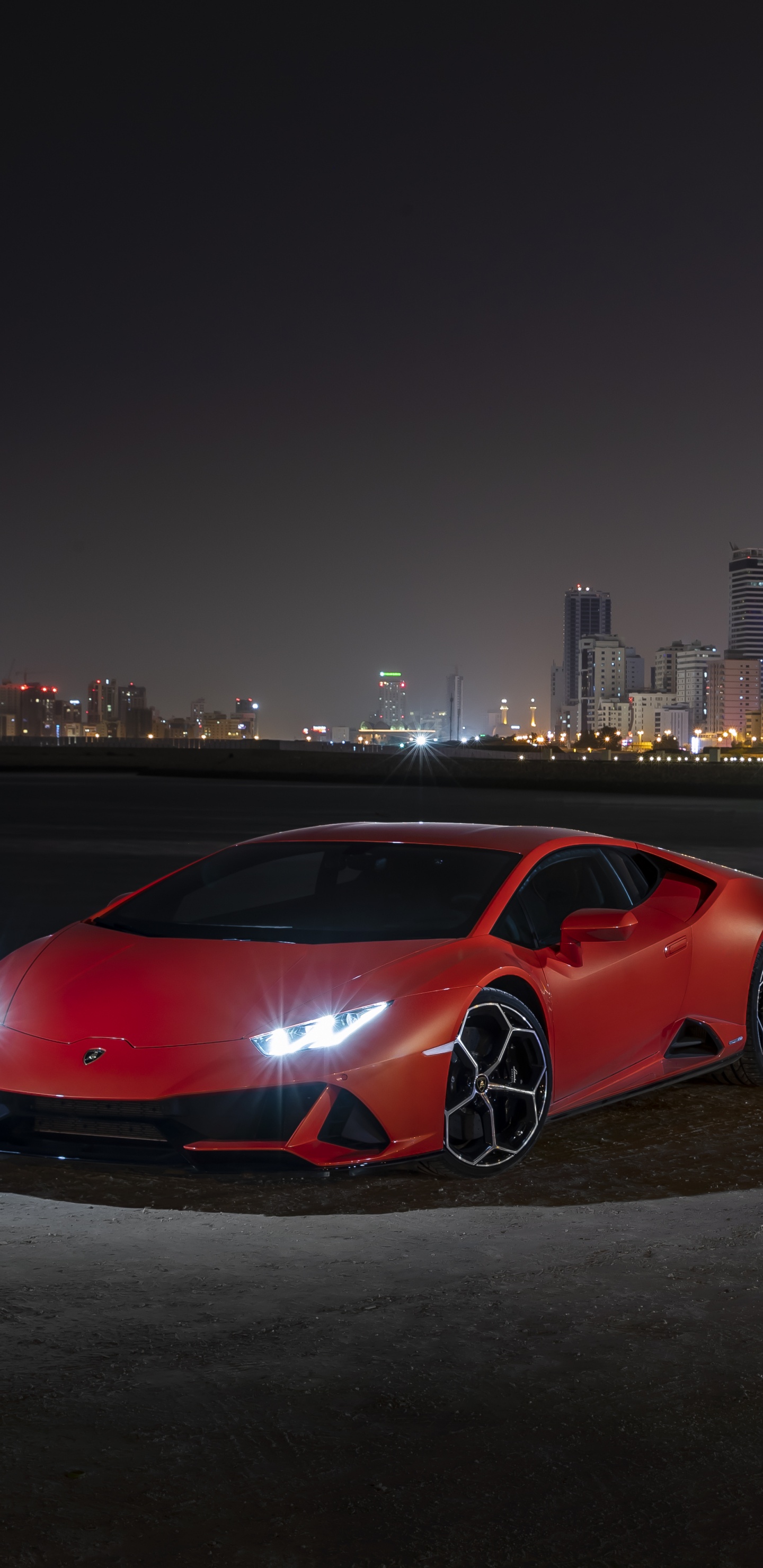 Red Coupe Parked on a Parking Lot. Wallpaper in 1440x2960 Resolution