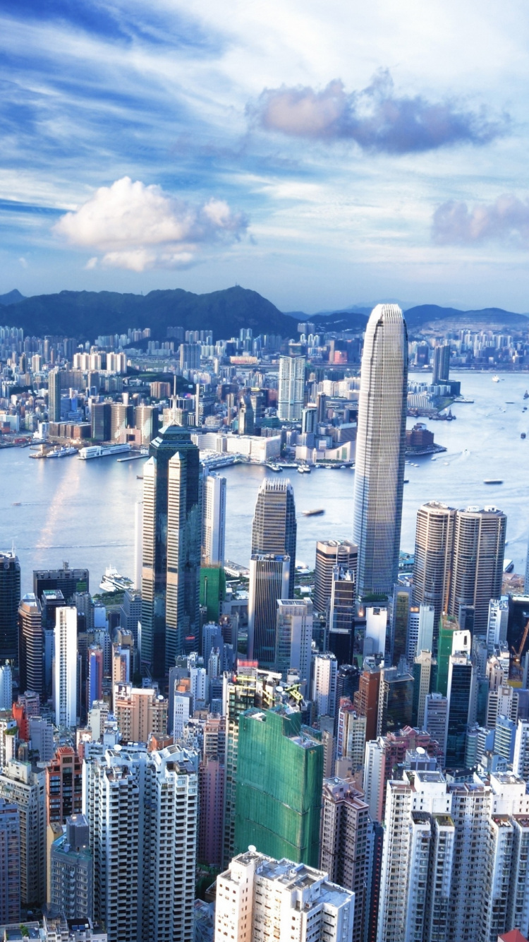 City Skyline Near Body of Water During Daytime. Wallpaper in 750x1334 Resolution