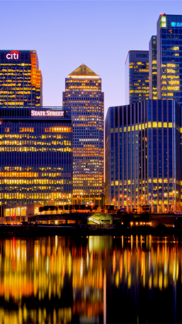 City Skyline Across Body of Water During Night Time. Wallpaper in 750x1334 Resolution