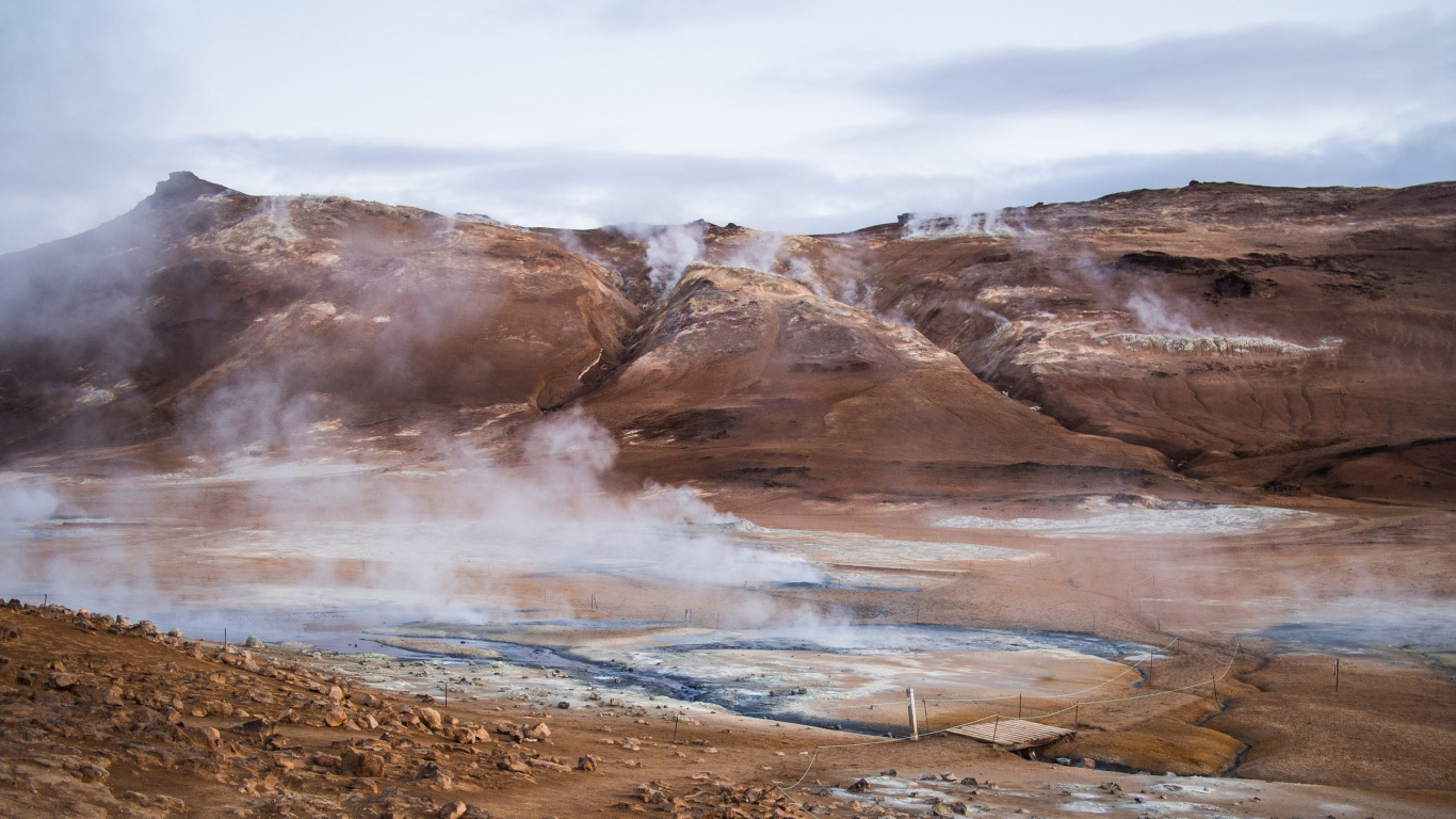 Brown Field Near Brown Mountain Under White Clouds During Daytime. Wallpaper in 1366x768 Resolution