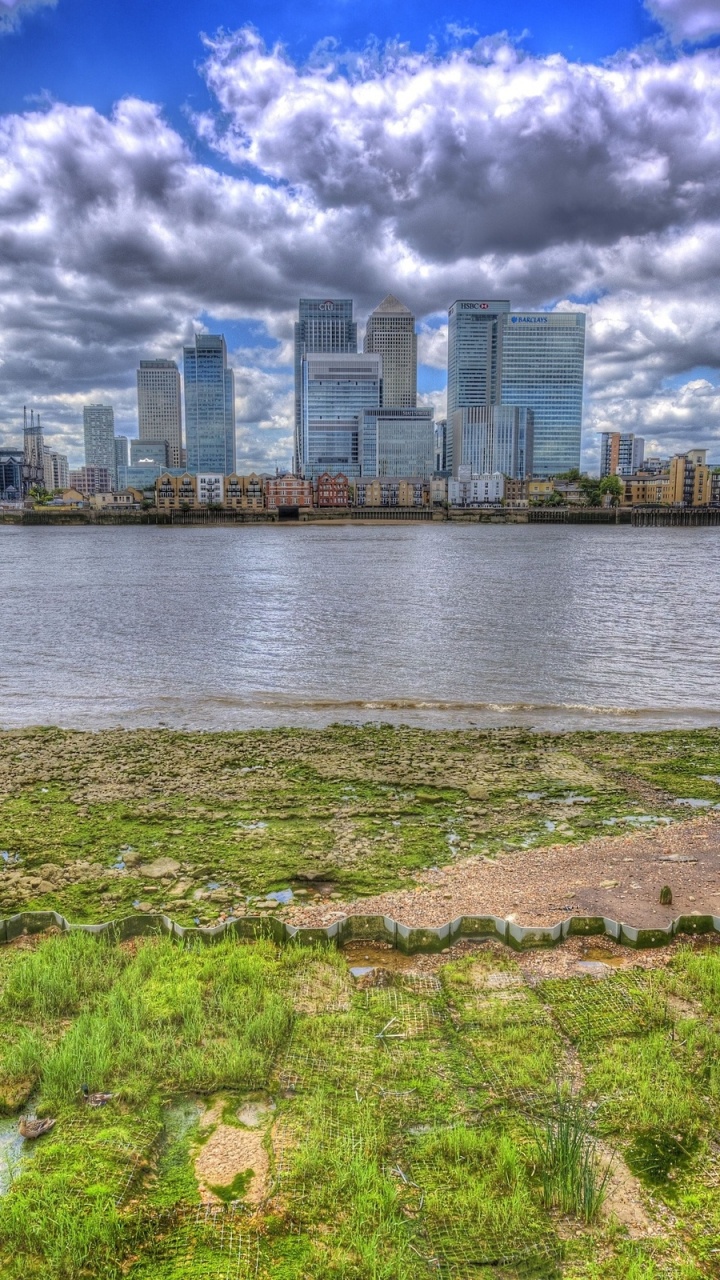 Body of Water Near City Buildings Under Cloudy Sky During Daytime. Wallpaper in 720x1280 Resolution