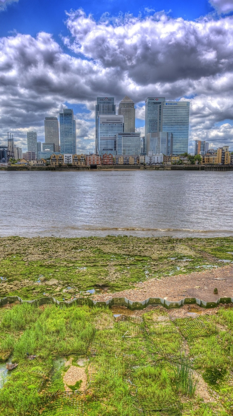 Body of Water Near City Buildings Under Cloudy Sky During Daytime. Wallpaper in 750x1334 Resolution