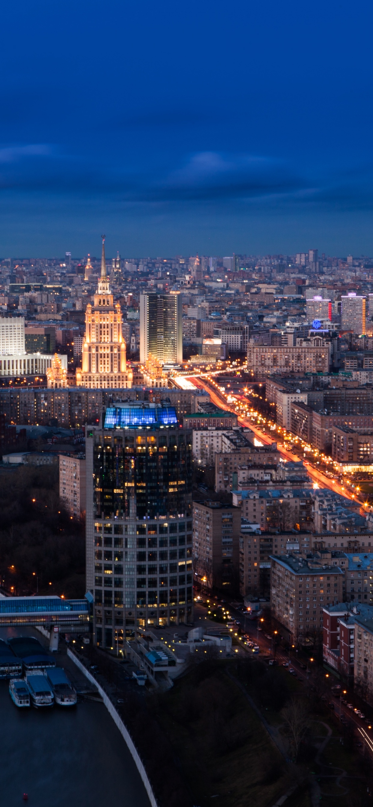 Aerial View of City Buildings During Night Time. Wallpaper in 1242x2688 Resolution