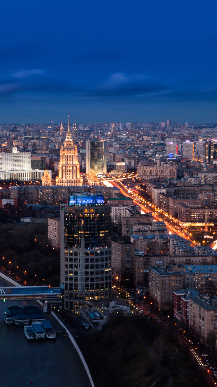 Aerial View of City Buildings During Night Time. Wallpaper in 750x1334 Resolution
