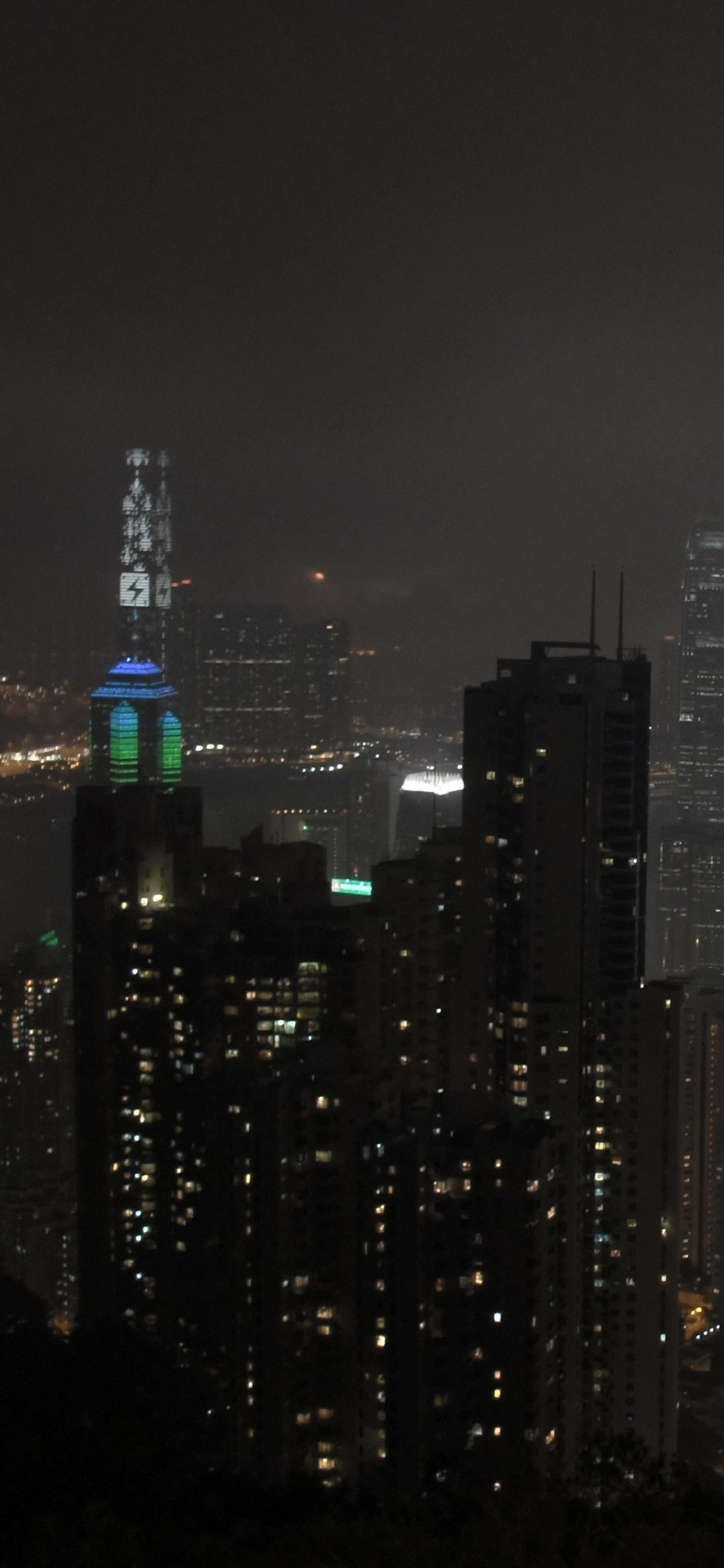 City Skyline During Night Time. Wallpaper in 1125x2436 Resolution