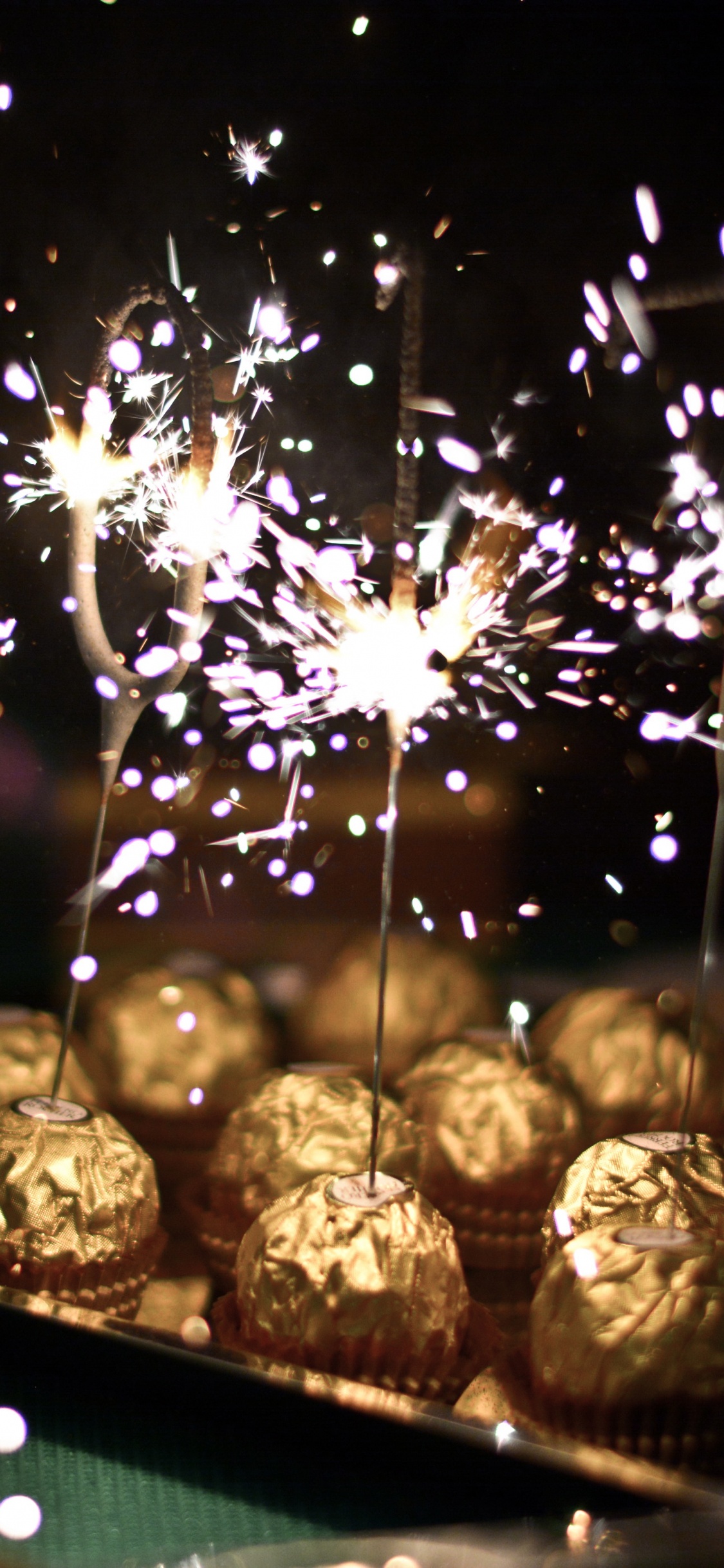 Chocolate Balls, Candy, Chocolate, Fireworks, Sparkler. Wallpaper in 1125x2436 Resolution