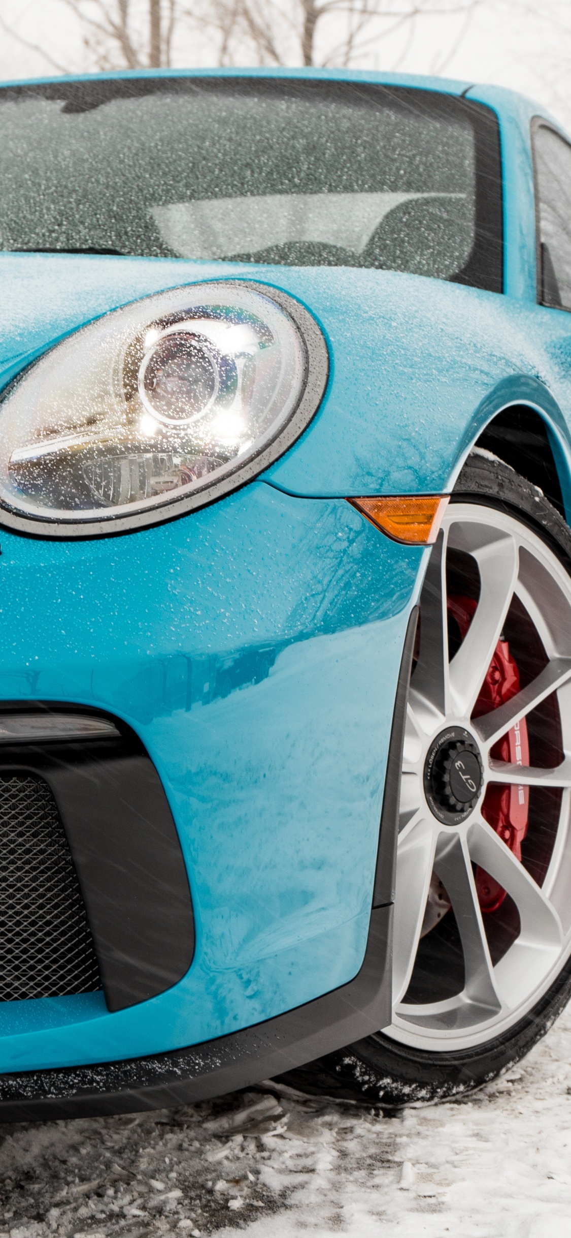 Blue Bmw m 3 Coupe on Snow Covered Ground During Daytime. Wallpaper in 1125x2436 Resolution