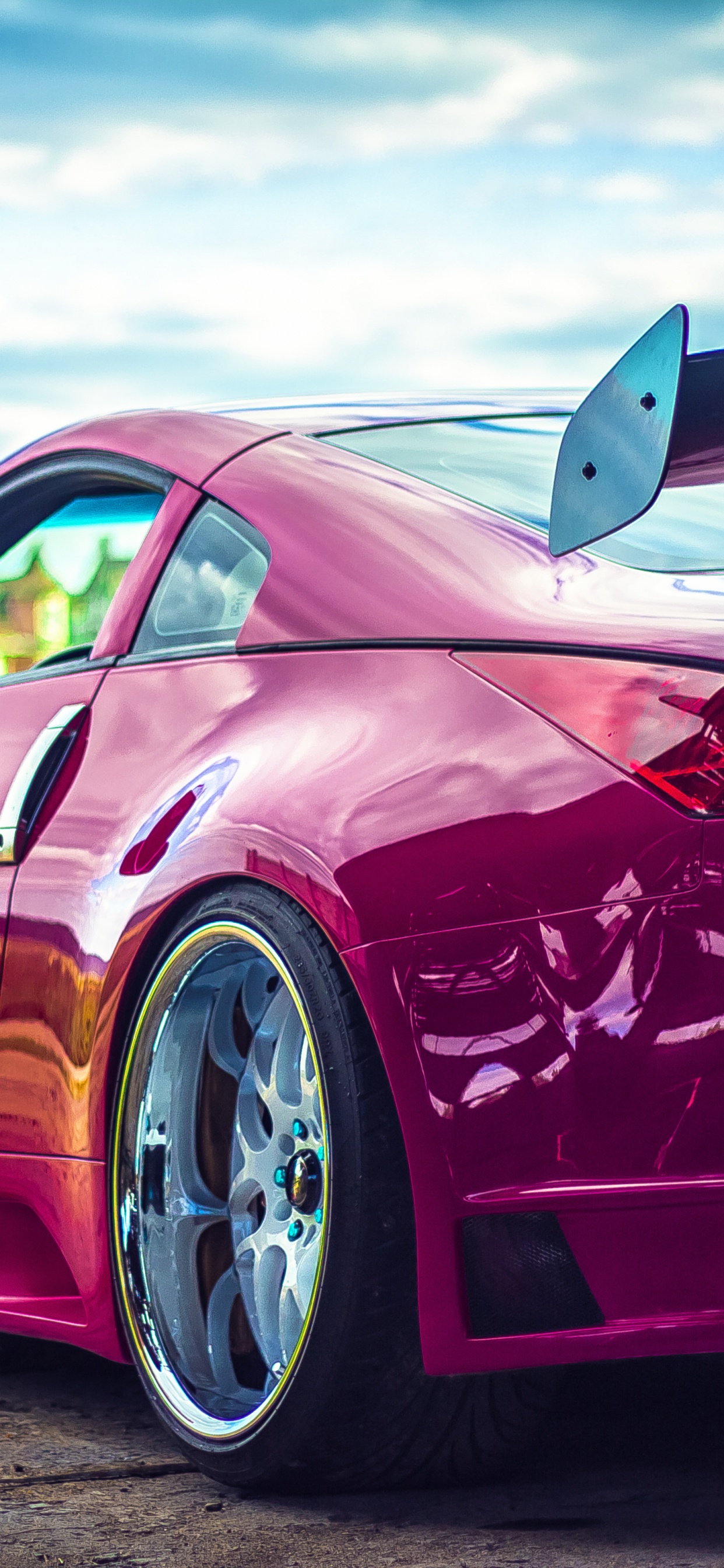 Red Porsche 911 on Green Grass Field During Daytime. Wallpaper in 1242x2688 Resolution