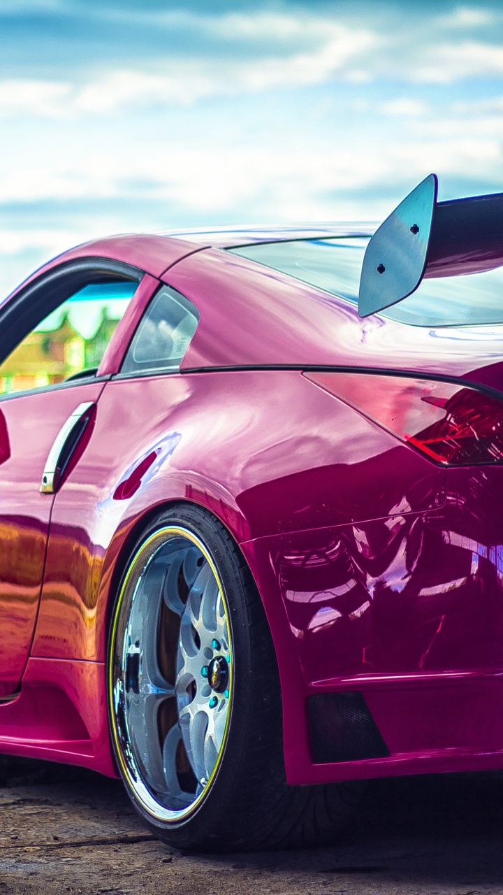 Red Porsche 911 on Green Grass Field During Daytime. Wallpaper in 720x1280 Resolution