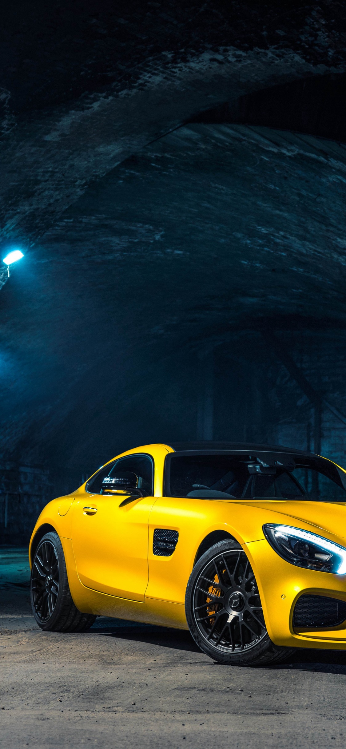 Yellow Porsche 911 Parked in Tunnel. Wallpaper in 1125x2436 Resolution