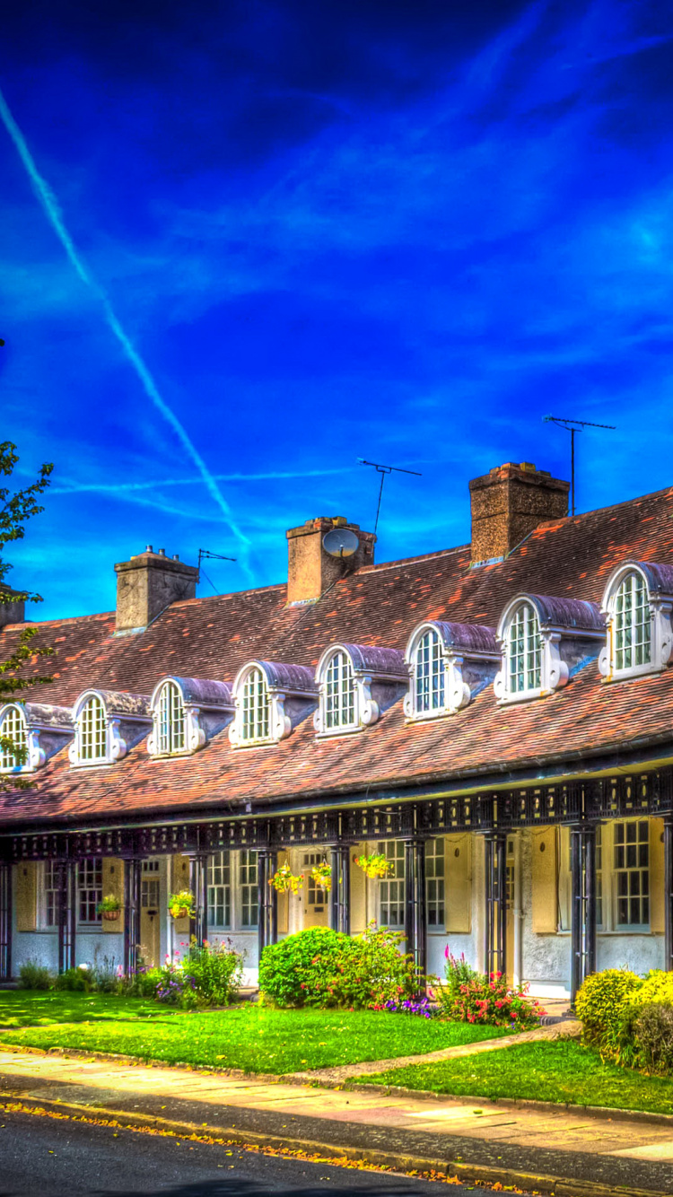 Brown and White Concrete Building Under Blue Sky During Daytime. Wallpaper in 750x1334 Resolution