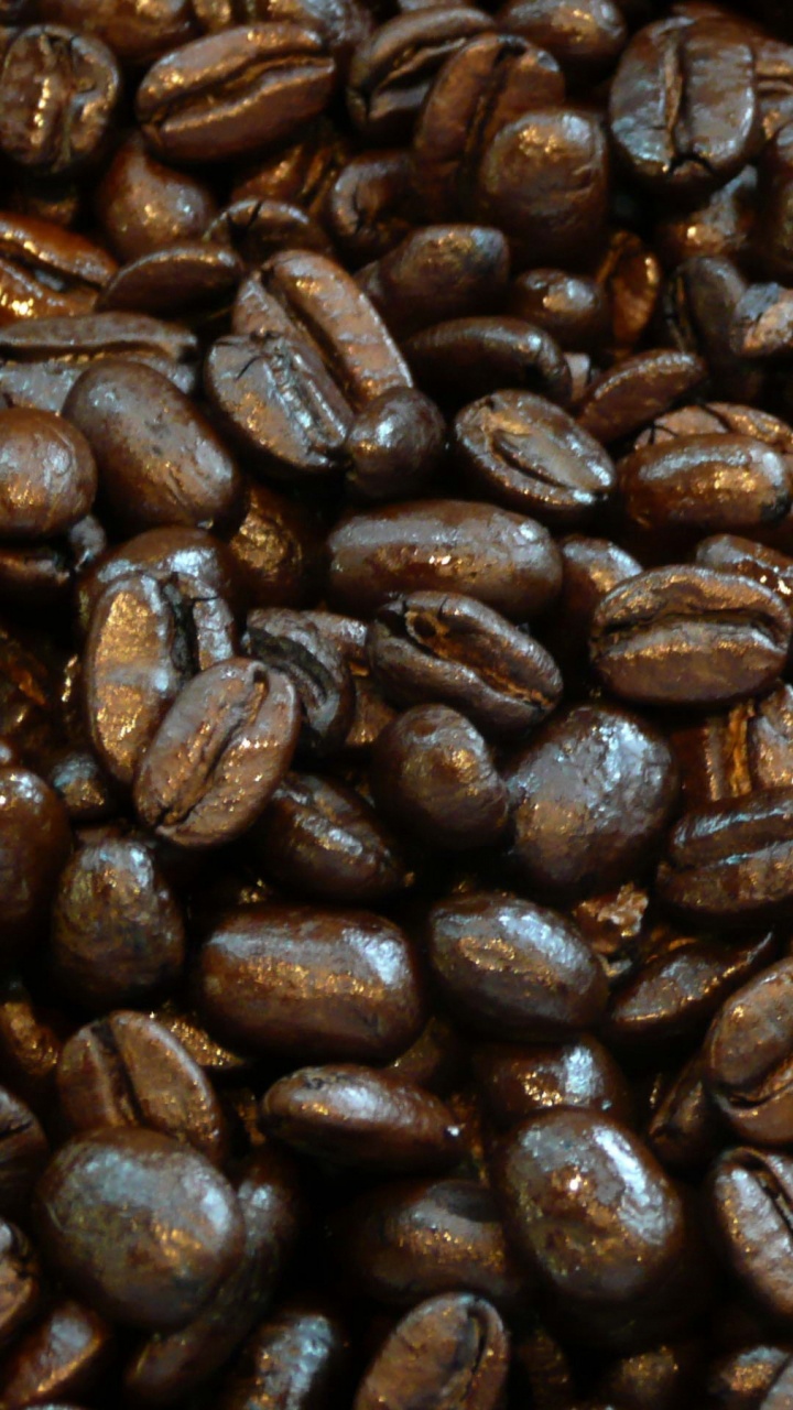 Brown Coffee Beans on Black Surface. Wallpaper in 720x1280 Resolution