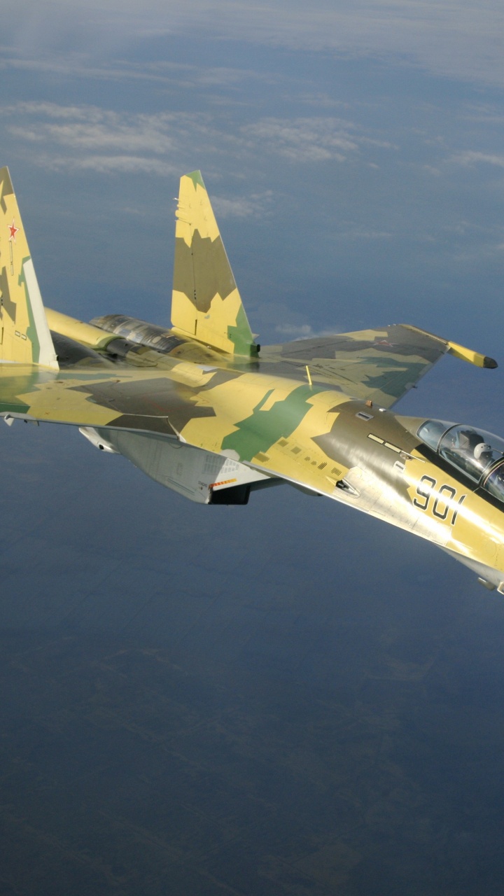 White and Yellow Jet Plane Flying in The Sky. Wallpaper in 720x1280 Resolution