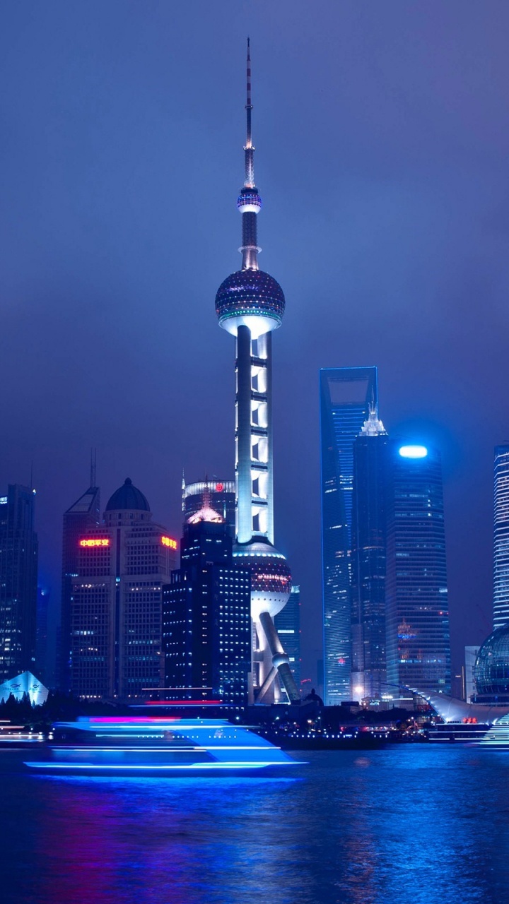 City Skyline During Night Time. Wallpaper in 720x1280 Resolution