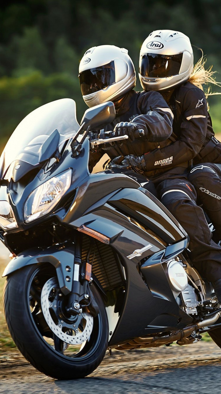 Man in Black and White Motorcycle Helmet Riding on Black Sports Bike During Daytime. Wallpaper in 750x1334 Resolution