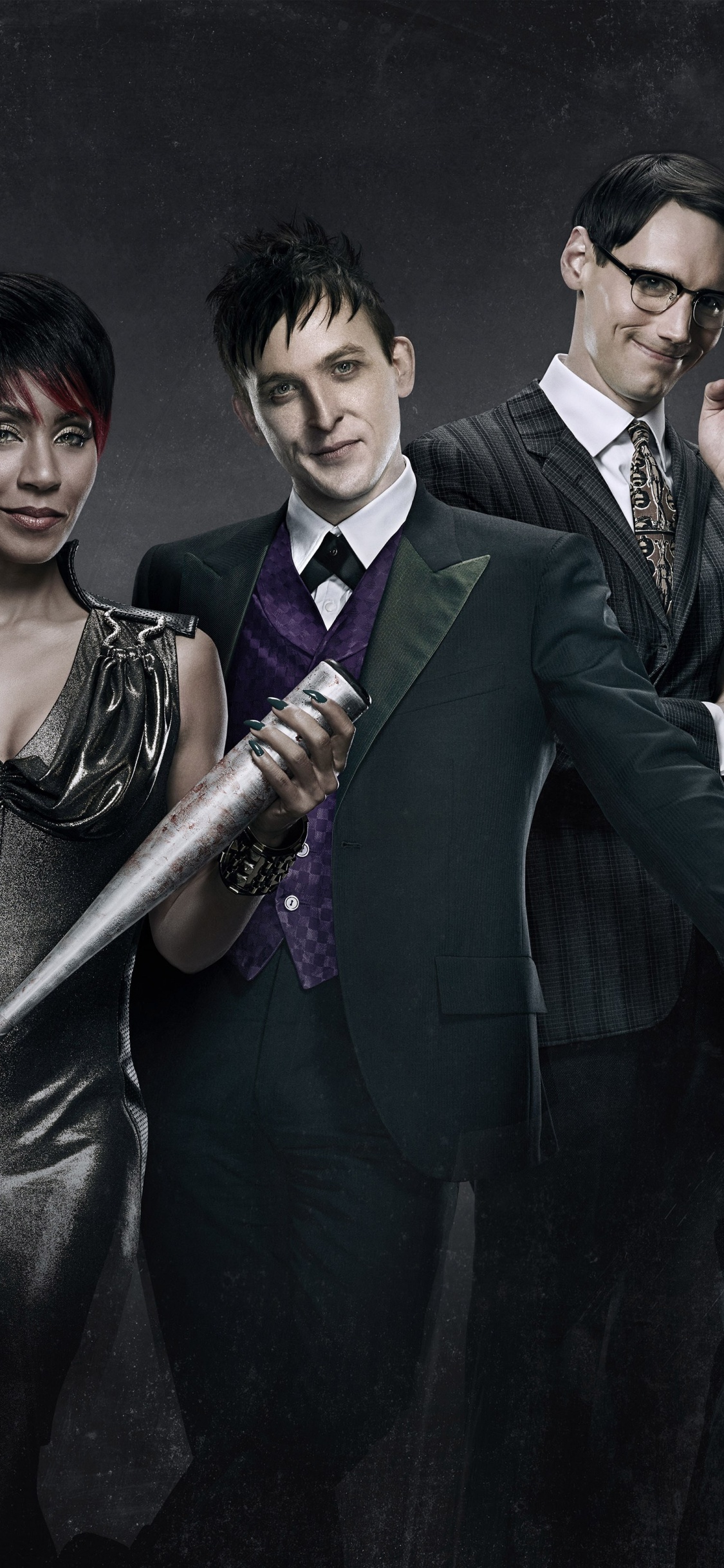 Man in Black Suit Jacket Holding Black Stick. Wallpaper in 1125x2436 Resolution