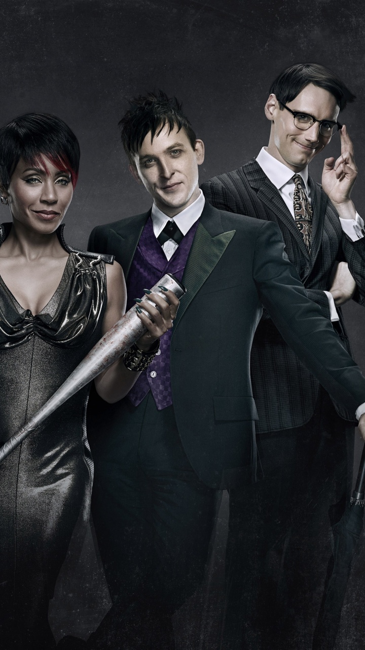 Man in Black Suit Jacket Holding Black Stick. Wallpaper in 720x1280 Resolution