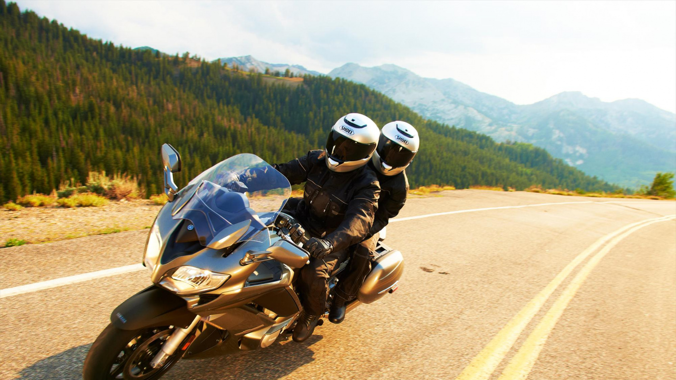 Man in Black Jacket Riding Motorcycle on Road During Daytime. Wallpaper in 1366x768 Resolution