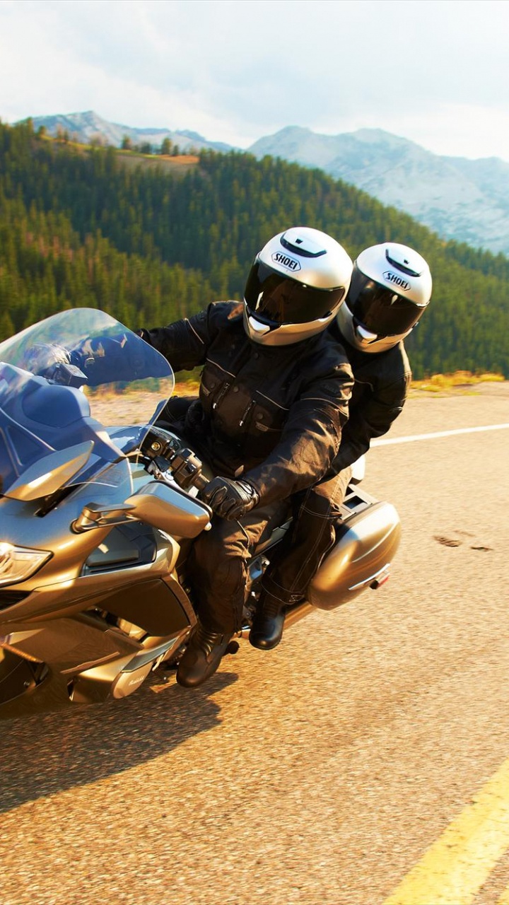 Man in Black Jacket Riding Motorcycle on Road During Daytime. Wallpaper in 720x1280 Resolution