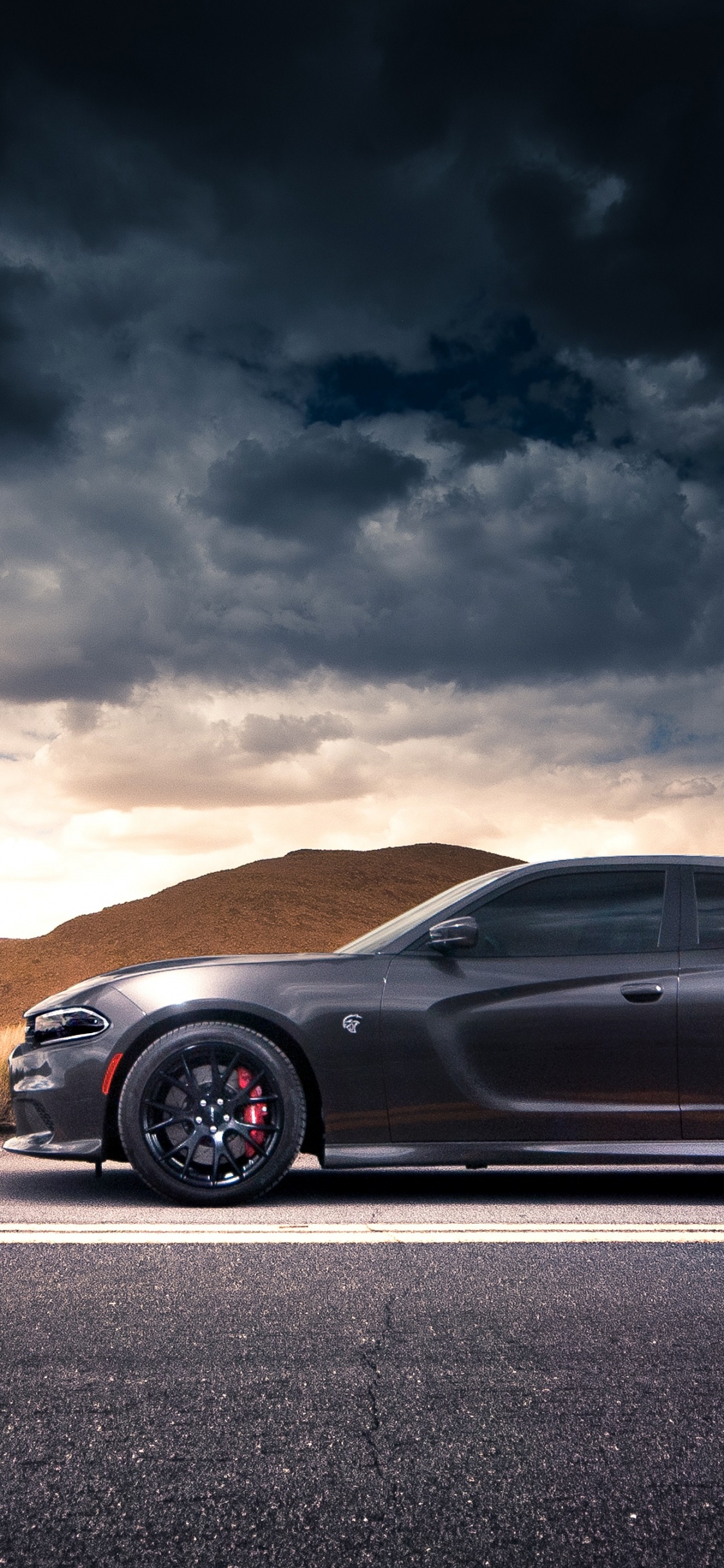 Black Porsche 911 on Road During Daytime. Wallpaper in 1125x2436 Resolution