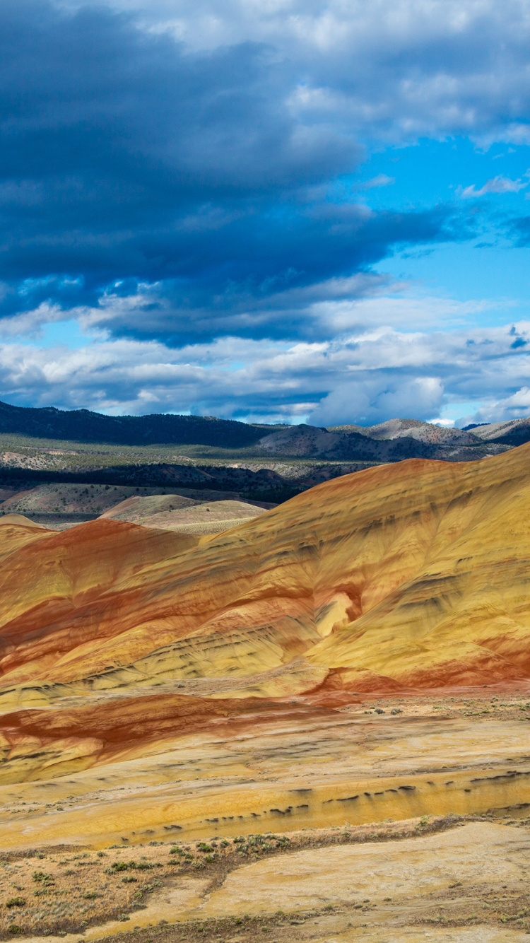 Brown and Gray Mountains Under Blue Sky During Daytime. Wallpaper in 750x1334 Resolution