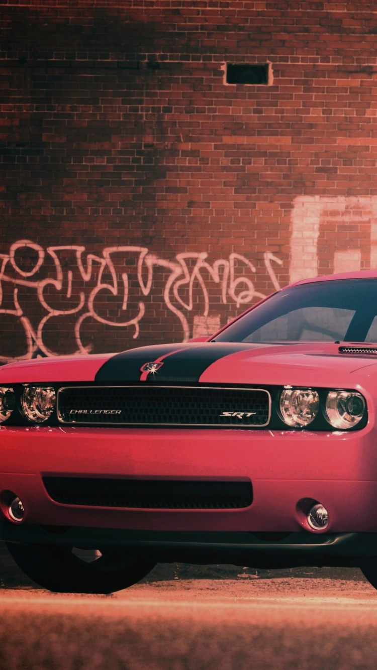 Red Mercedes Benz Coupe Parked Beside Brown Brick Wall. Wallpaper in 750x1334 Resolution
