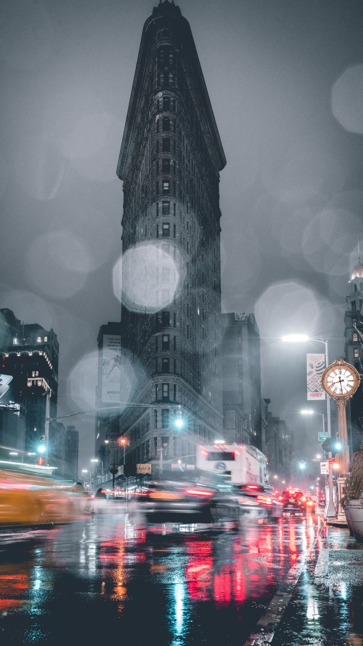 Cars on Road Near High Rise Buildings During Night Time. Wallpaper in 720x1280 Resolution